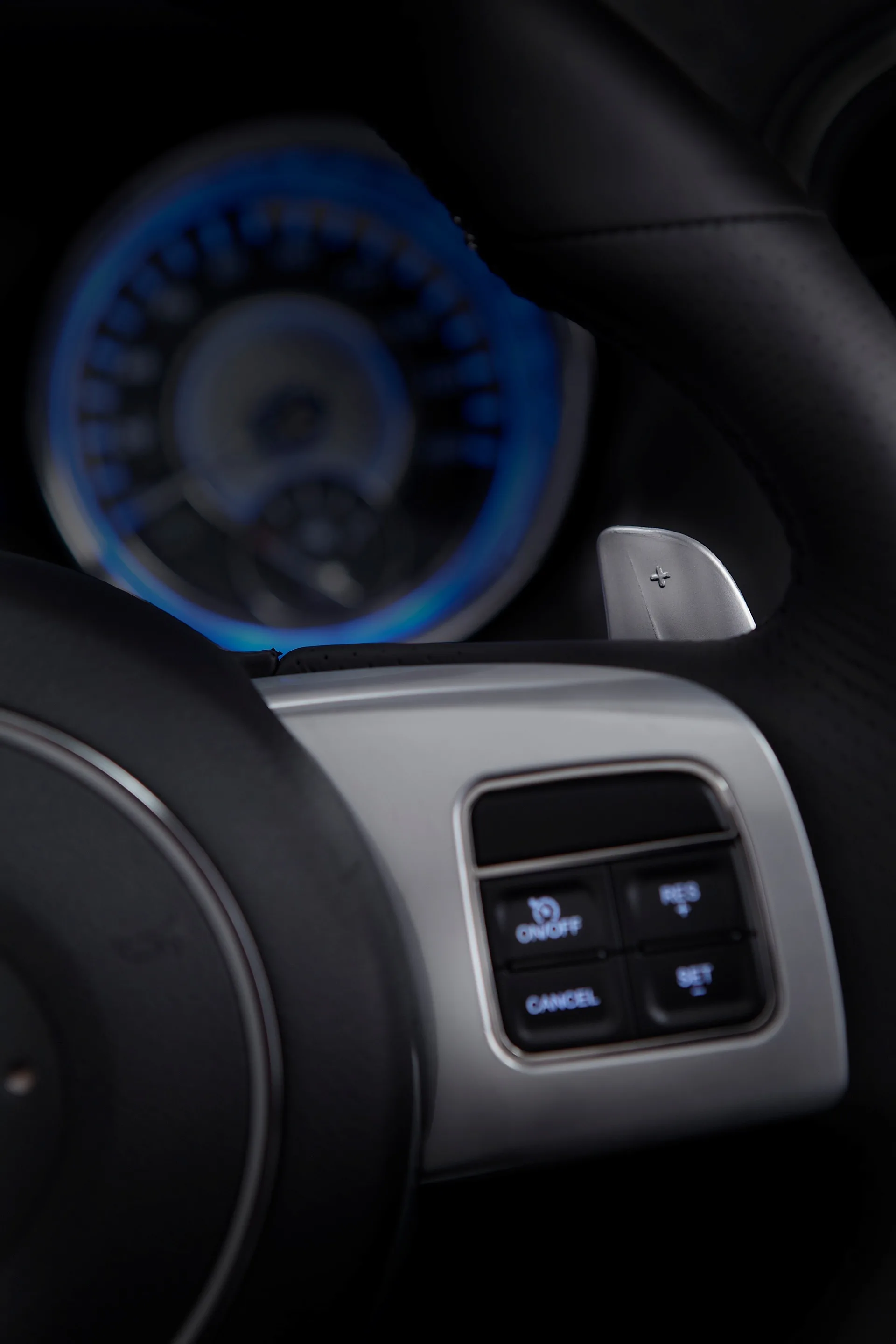 Standard paddle shift controls flank both sides of the new contoured palm rests while all audio and Electronic Vehicle Information Center (EVIC) controls are accessible from the horizontal spokes on the steering wheel.
