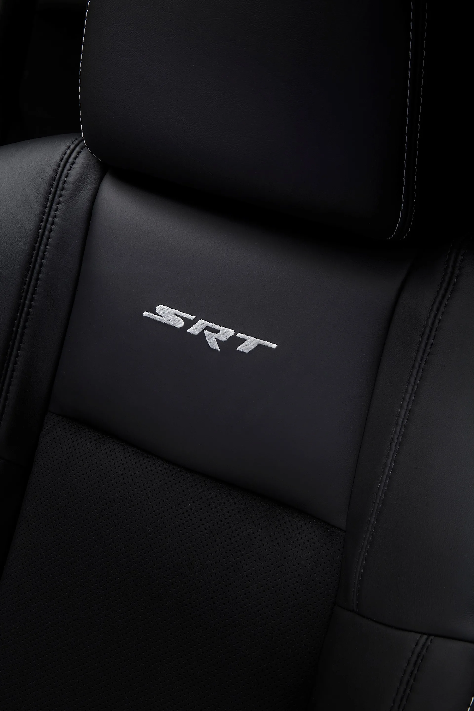The standard heated and ventilated front seats have active head rests with the SRT logo embroidered in seat backs.